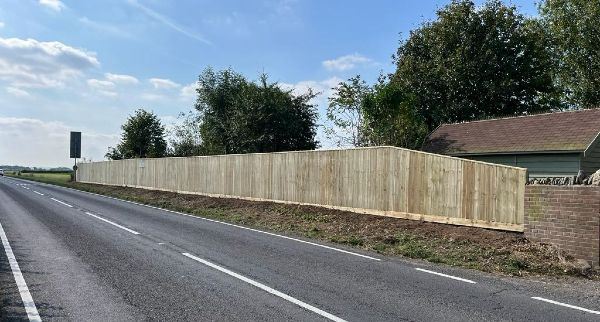 Close board fencing along a main road near Abingdon